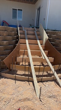 a set of stairs being built in front of a house