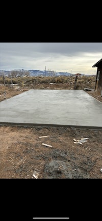 a concrete slab in the middle of a field